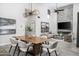 Stylish dining room adjacent to the living room, with high ceilings and modern decor at 2445 E Oregon Ave, Phoenix, AZ 85016