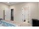 Bedroom with access to bathroom and additional room at 27453 W Wahalla Ln, Buckeye, AZ 85396