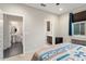 Bedroom with ensuite bathroom and access to a second bathroom at 27453 W Wahalla Ln, Buckeye, AZ 85396
