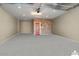 Garage with epoxy floor and brick feature wall at 27453 W Wahalla Ln, Buckeye, AZ 85396