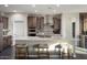Modern kitchen with stainless steel appliances and a large island at 27453 W Wahalla Ln, Buckeye, AZ 85396