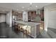 Modern kitchen with stainless steel appliances and an expansive island at 27453 W Wahalla Ln, Buckeye, AZ 85396