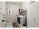 Laundry room with washer, dryer, and storage at 27453 W Wahalla Ln, Buckeye, AZ 85396