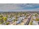 Aerial perspective offering a wide view of the property and surrounding neighborhood, showcasing distant city skyline at 2937 E Osborn Rd, Phoenix, AZ 85016