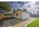 Charming backyard with artificial turf, a yellow door, and a modern wood fence at 2937 E Osborn Rd, Phoenix, AZ 85016