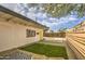 Private backyard oasis with artificial grass and a modern wooden fence at 2937 E Osborn Rd, Phoenix, AZ 85016