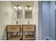Updated bathroom with double sinks, modern vanity, and a walk-in shower at 2937 E Osborn Rd, Phoenix, AZ 85016