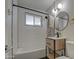 Modern bathroom with a bathtub, updated vanity, and a black and white tile shower at 2937 E Osborn Rd, Phoenix, AZ 85016
