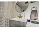 Modern bathroom with gray vanity and gold fixtures at 2937 E Osborn Rd, Phoenix, AZ 85016