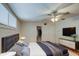 Bright bedroom with a king-size bed, ceiling fan, and ample closet space at 2937 E Osborn Rd, Phoenix, AZ 85016