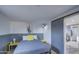 Small bedroom with gray bedding and yellow accent pillows at 2937 E Osborn Rd, Phoenix, AZ 85016