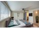 Comfortable bedroom with king bed, built-in wardrobe, and hardwood floors at 2937 E Osborn Rd, Phoenix, AZ 85016