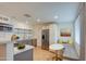 Modern kitchen with gray cabinets, white quartz countertops, and stainless steel appliances at 2937 E Osborn Rd, Phoenix, AZ 85016