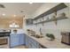 Stylish kitchen features gray cabinets, white quartz countertops, and modern appliances at 2937 E Osborn Rd, Phoenix, AZ 85016