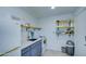 Modern kitchen with white appliances and yellow shelving at 2937 E Osborn Rd, Phoenix, AZ 85016