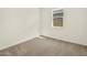Bright bedroom with neutral carpeting, a window and ample natural light at 37073 W La Paz St, Maricopa, AZ 85138
