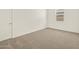 Bright bedroom with neutral carpeting, a window and ample natural light at 37073 W La Paz St, Maricopa, AZ 85138
