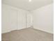 Spacious bedroom with clean white walls and neutral carpet, ready for personalization at 37073 W La Paz St, Maricopa, AZ 85138