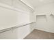 Spacious walk-in closet with multiple shelves and hanging rods at 37073 W La Paz St, Maricopa, AZ 85138