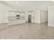 Modern kitchen with stainless steel appliances, quartz countertops, and pendant lighting over the island at 37073 W La Paz St, Maricopa, AZ 85138