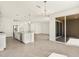 Open-concept kitchen and living area with stainless steel appliances and ample counter space at 37073 W La Paz St, Maricopa, AZ 85138