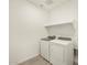 Well-lit laundry room featuring modern, full-sized washer and dryer at 37073 W La Paz St, Maricopa, AZ 85138