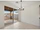 Dining area with large sliding glass door providing views of the backyard and natural light at 37358 W San Clemente St, Maricopa, AZ 85138