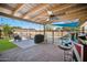 Covered patio with pool, grill, and seating area at 4016 W Myrtle Ave, Phoenix, AZ 85051
