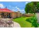 Large backyard with grass, patio, and trampoline at 4016 W Myrtle Ave, Phoenix, AZ 85051