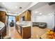 Open kitchen with stainless steel appliances and wood cabinetry at 4016 W Myrtle Ave, Phoenix, AZ 85051