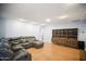 Living room with a sectional sofa, hardwood floors and built-in shelving at 4016 W Myrtle Ave, Phoenix, AZ 85051