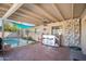 Outdoor patio bar with seating and pool view at 4016 W Myrtle Ave, Phoenix, AZ 85051