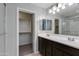 Double vanity bathroom with walk-in shower and closet at 4159 E Pony Ln, Gilbert, AZ 85295