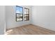 Bright bedroom with two large windows providing natural light and a view of the neighborhood at 42104 N Golden Trl, San Tan Valley, AZ 85140
