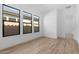 Bright bedroom with three large windows offering ample natural light and a view of the outdoors at 42104 N Golden Trl, San Tan Valley, AZ 85140