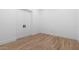 Clean and bright bedroom with wood floors and double doors for closet space at 42104 N Golden Trl, San Tan Valley, AZ 85140