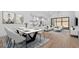 Open-concept living and dining area featuring a modern dining table and comfortable seating arrangement at 42104 N Golden Trl, San Tan Valley, AZ 85140