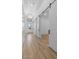 Bright hallway with tile floors and multiple doors leading to various rooms in the house at 42104 N Golden Trl, San Tan Valley, AZ 85140