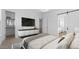 Luxurious main bedroom featuring sliding door to bathroom, a walk-in closet, and a sleek console table at 42104 N Golden Trl, San Tan Valley, AZ 85140