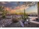 Landscaped yard with cacti and rocks at sunset at 44710 N 18Th St, New River, AZ 85087