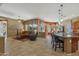 Open concept living and kitchen area with tile floors at 4523 E Rakestraw Ln, Gilbert, AZ 85298