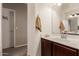 Guest bathroom with a single vanity and dark brown cabinets at 4752 E Lavender Ln, Phoenix, AZ 85044