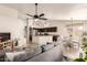 Open floor plan with kitchen island, dark cabinetry, and gray living room sofa at 4752 E Lavender Ln, Phoenix, AZ 85044