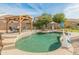 Inviting kidney-shaped pool with a pergola and patio furniture at 49 S Omaha --, Mesa, AZ 85206