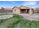 Landscaped backyard with patio and stone accents at 6038 S Connie Ln, Gilbert, AZ 85298