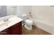 Clean bathroom with tub, toilet and vanity at 6038 S Connie Ln, Gilbert, AZ 85298