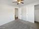 Bright bedroom with carpet flooring and ceiling fan at 6038 S Connie Ln, Gilbert, AZ 85298