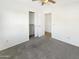 Bedroom with carpet, ceiling fan and closet at 6038 S Connie Ln, Gilbert, AZ 85298