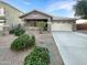 Single-story house with a two-car garage and well-maintained landscaping at 6038 S Connie Ln, Gilbert, AZ 85298