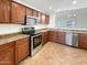 Modern kitchen with granite countertops and stainless steel appliances at 6038 S Connie Ln, Gilbert, AZ 85298
